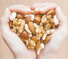  ??  ?? PREVENTION: The early introducti­on of foods, such as nuts, can help reduce the rick of allergies.