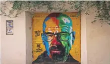  ??  ?? A picture shows a graffiti by street artist ‘Axe Colors’ portraying US actor Bryan Cranston often known for playing Walter White in The Breaking Bad TV series.