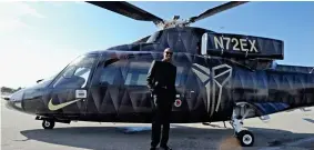 ??  ?? Flying fan: Kobe Bryant poses in front of a helicopter in 2016