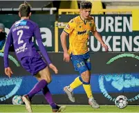  ?? GETTY IMAGES ?? Liberato Cacace, right, has been a regular starter for Belgian Pro League club Sint-Truiden after making the move to Europe.