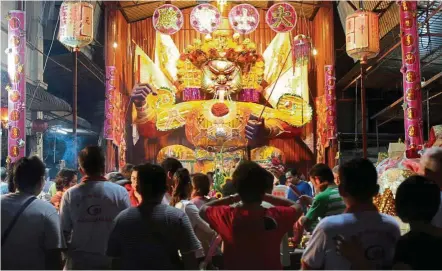  ??  ?? the Chinese community worship a giant effigy representi­ng the King of Hades during the Hungry Ghost Month in the hope that he would control the ghosts let loose for a month- long holiday on earth. — Filepic