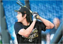  ?? AFP-Yonhap ?? Lee Jung-hoo of the San Francisco Giants takes batting practice wearing a T-shirt for Jackie Robinson Day prior to a game against the Miami Marlins at loanDepot park in Miami, Fla., Monday.