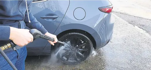  ??  ?? Don’t forget the wheel arches when washing your car, and cleaning off any water beads with a clean microfibre cloth