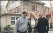  ??  ?? Liberty Tap Room co-owners are shown April 6, 2011. From left are Gregory Russoli, his fiancée at the time, Sherry Julian, and her son, Tony Reber. They purchased the former Chat-a-While Cafe in Exeter Township and remodeled it. Now, the Russolis and Reber have purchased the former Dryville Hotel and plan to open Liberty at Dryville in early 2021.