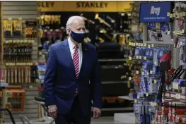  ?? PATRICK SEMANSKY — THE ASSOCIATED PRESS ?? President Joe Biden visits W.S. Jenks & Son hardware store in Washington on Tuesday.