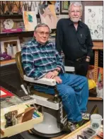  ?? WILLIAM HARVEY/TRILAKES EDITION ?? Hot Springs artists Richard Stephens, seated, and Gary Simmons pose in Simmons’ studio. The two artists will serve as grand marshals of the Oaklawn Rotary Christmas Parade on Dec. 7 in downtown Hot Springs. The theme of this year’s parade is “The Art...