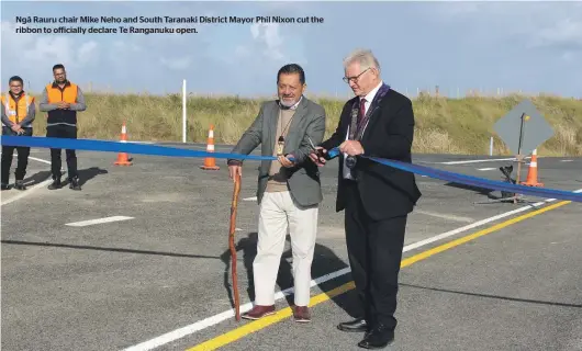  ?? ?? Ngā Rauru chair Mike Neho and South Taranaki District Mayor Phil Nixon cut the ribbon to officially declare Te Ranganuku open.