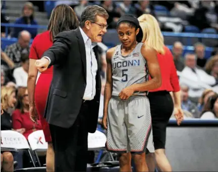  ?? JESSICA HILL — THE ASSOCIATED PRESS FILE PHOTO ?? UConn coach Geno Auriemma talks with Crystal Dangerfiel­d during a game earlier this season.