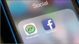  ?? ASSOCIATED PRESS ?? Facebook and Facebook’s Messenger Kids app icons are displayed on an iPhone in New York. Facebook is adding a “sleep” mode to its Messenger Kids service so parents can limit how much time children spend on it.