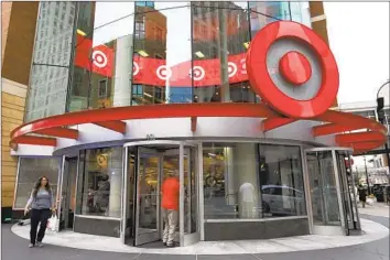  ?? Jim Mone Associated Press ?? THE NEW SERVICE promises quick deliveries for an annual fee. CEO Brian Cornell said it wasn’t a shift away from in-store shopping, noting that Target plans to open more than 300 new stores in the next decade.