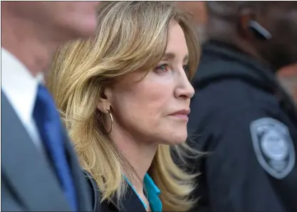  ?? OSEPH PREZIOSO — AFP VIA GETTY IMAGES ?? Actress Felicity Huffman exits the courthouse after facing charges for allegedly conspiring to commit mail fraud and other charges in the college admissions scandal at the John Joseph Moakley United States Courthouse in Boston on April 3.