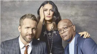  ??  ?? The Hitman’s Bodyguard stars (from left) Ryan Reynolds, Salma Hayek and Samuel L. Jackson