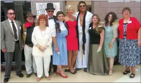  ?? Photo by Susan Holland ?? Murder suspects in the “Who Dun It?” game at the Gravette Public Library gala Oct. 7 included Groucho Marx (Merv Boyd), left, John Wayne (Larry Jones), Lucille Ball (Lois Phippen), Fred Astaire (Jay Oliphant), Judy Garland (Linda Oliphant), Marilyn...