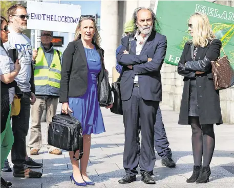  ?? PHOTO: STEVE HUMPHREYS ?? Objection: Gemma O’Doherty, John Waters and his wife Rita Simons outside the High Court in Dublin during the hearing last week.