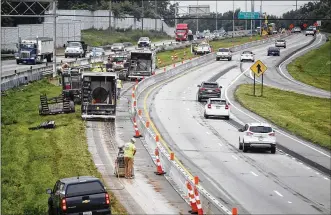  ?? TY GREENLEES / STAFF ?? Contractor­s have shifted lanes and removed the median crossover barriers on a stretch of U.S. 35 in Dayton to prepare for the Smithville Road access project. The flyover bridge from northbound Smithville Road to U.S. 35 West will be removed, and improvemen­ts will be made so that traffic going both directions on Smithville will use the same westbound U.S. 35 ramp.