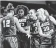  ?? BRENDAN MALONEY, USA TODAY SPORTS ?? James Madison players huddle up in Sunday’s win against Gonzaga.