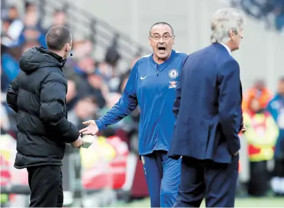  ??  ?? Chelsea manager Maurizio Sarri reacts as West Ham United manager Manuel Pellegrini looks on during their English Premier League match at London Stadium yesterday. It ended 0-0. — Reuters