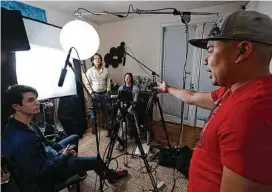  ??  ?? Left to right, actors Rex Bressler, Toho Ru and Tiffany Chu listen to director and show co-creator Bernie Su as they prepare to do a scene for the show.