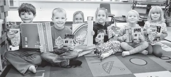  ?? [WHITNEY NEILSON / THE OBSERVER] ?? Janet Martin’s Kindergart­en class at Floradale PS has been collecting items to make Mennonite Central Committee school kits for students overseas. Six of the students show some of what they’ve gathered. From left: Isaac Martin, Jack Carlaw-Dick, Alanna Frey, Natalie Brubacher, Jessica Reger and Ally Adams.