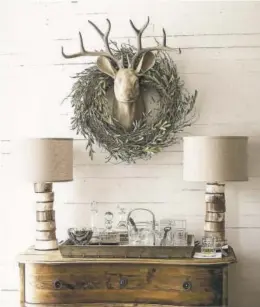  ?? PHOTOS COURTESY OF PINTEREST ?? Another even more rustic stag’s head, above, done in the hygge style. This antique ornament, below, was made in Dresden. German ornaments from the 19th century were known for their realism and detail.