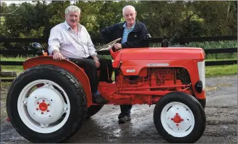  ??  ?? Brendan Ferris and James Clifford with the 1961 BMC Mini tractor planning for the Beaufort Threshing Cancer Day which will take place on Sunday 24th September.