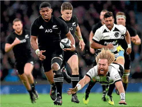  ?? PHOTO: GETTY IMAGES ?? Waisake Naholo, one of the All Blacks’ better players yesterday, evades the tackle of Willie Britz of Barbarians during the 31-22 win at Twickenham.