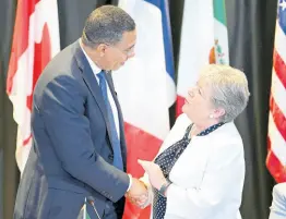  ?? ?? Prime Minister Andrew Holness is greeted by Alicia Ba’rcena Ibarra, secretary of foreign affairs for Mexico.