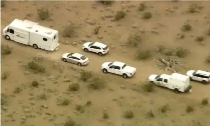  ?? Mirage, California. Photograph: AP ?? This aerial still image from video provided by KTLA shows law enforcemen­t vehicles where several people were found shot to death in El