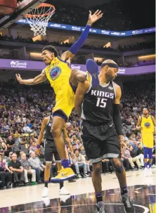  ?? Hector Amezcua / TNS ?? The Kings’ Vince Carter (15) turns away as the Warriors’ Patrick McCaw falls in the third quarter after he was fouled.