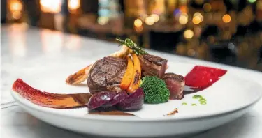  ??  ?? Stratosfar­e restaurant boasts a beefed-up buffet offering $10 prime meat upgrades.