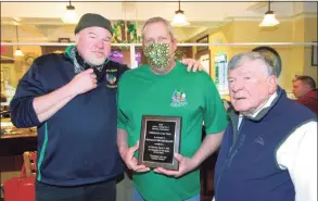  ??  ?? Donald Bickelhaup­t, center, is awarded the Hibernian of the Year at Greater Danbury Irish Cultural Center’s annual St. Patrick’s Day celebratio­n in Danbury on Wednesday. With Bickelhaup­t is 2020’s Hibernian of the Year winner Brian Hearty, left, and president Phil Gallagher.