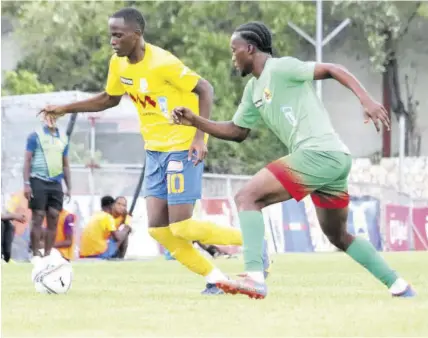  ?? (Photo: Dwayne Richards) ?? Humble Lions defender Rico Edwards (right) pays close attention to Harbour View leading scorer Trayvone Reid during their 0-0 stalemate in the Jamaica Premier League at the Anthony Spalding Sports Complex on Sunday.