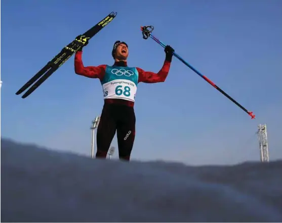  ?? FOTO: CARLOS BARRIA, REUTERS/NTB SCANPIX ?? Dario Cologna jublet for sitt tredje OL-gull på rad på 15 kilometer, hans fjerde OL-gull totalt.