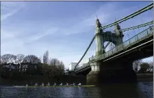  ?? JOHN WALTON — PA VIA AP ?? The Cambridge men’s team pass under Hammersmit­h Bridge during a training session on the River Thames in London, Tuesday March 26, 2024.