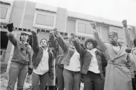  ?? Photograph: Bettmann/Bettmann Archive ?? Mourners of Move members stand in front of their former headquarte­rs.