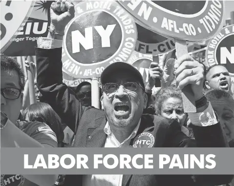  ?? SPENCER PLATT GETTY IMAGES ?? Union workers cheer as New York Gov. Andrew Cuomo speaks to at a rally in NYC’s Union Square on May 7. Though the labor market shows positive signs, U. S. ranks of part- time workers who would prefer full- time jobs remain swollen at 6.7 million.