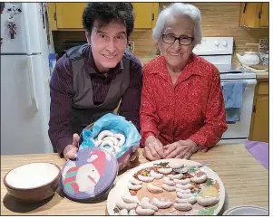  ??  ?? Tav Falco and his mother, Rita Nelson of Hot Springs, pose with holiday goodies.