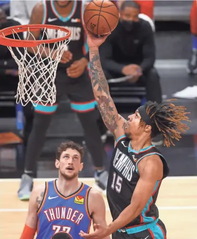  ?? JOE RONDONE/THE COMMERCIAL APPEAL ?? Memphis Grizzlies forward Brandon Clarke lays the ball in against the Oklahoma City Thunder during their game at the Fedexforum in Memphis, Tenn. on Feb. 17, 2021.