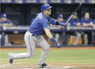  ?? CHRIS O’MEARA/ THE ASSOCIATED PRESS ?? Toronto Blue Jays’ Troy Tulowitzki flies out to Tampa Bay Rays outfielder Mikie Mahtook during the second inning on Friday. It was Tulowitzki’s first game since Sept. 12, when he suffered a small crack in his left shoulder blade.