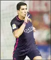  ?? (AP) ?? Barcelona’s Luis Alberto Suarez from Uruguay celebrates after scoring against Granada during a Spanish La Liga soccer match between Granada and Barcelona in
Granada, Spain on April 2.