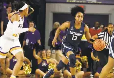  ?? Karl B DeBlaker / Associated Press ?? UConn’s Christyn Williams brings the ball down the court against East Carolina during the first half on Jan. 25 in Greenville, N.C.