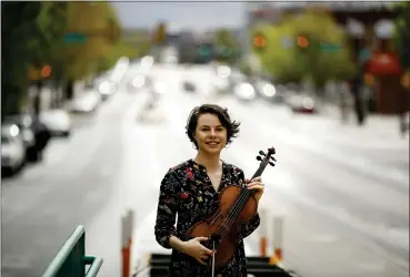  ?? MATT ROURKE — THE ASSOCIATED PRESS ?? Violist Brooke Mead poses for a photograph May 1in Philadelph­ia. Devastated by the cancellati­on of her graduate recital because of coronaviru­s concerns, Mead was invited to perform instead on the Philadelph­ia Orchestra’s live webcast.