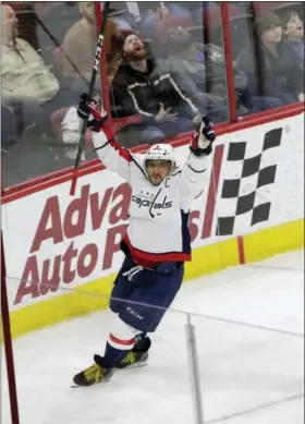  ?? GERRY BROOME — THE ASSOCIATED PRESS ?? Capitals’ Alex Ovechkin (8) celebrates his goal against the Hurricanes, Tuesday. Washington won 5-4 in overtime.