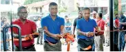  ??  ?? DPMC Managing Director Rohana Dissanayak­e, Director Marketing Jagath Kulatunga and Director Parts and Accessorie­s Thusitha Molligoda cut the ribbon