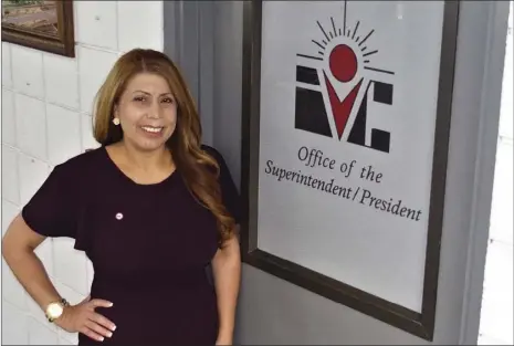  ??  ?? Imperial Valley College’s new president and superinten­dent, Martha Garcia, stands beside the door of the office she’ll be assuming as of July 1. TOM BODUS PHOTO