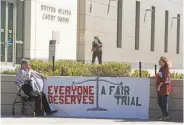  ?? Red Huber / Associated Press ?? Members of a civil liberties group gather outside the courthouse where Noor Salman is on trial.