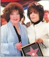  ??  ?? Liz Taylor (left) and Carole Bayer Sager collecting Sager’s star on the Hollywood Walk of Fame in 2000