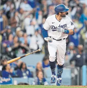  ?? ASHLEY LANDIS THE ASSOCIATED PRESS ?? The Dodgers’ Chris Taylor watches his second inning home run, the first of three, against the Braves in Game 5 of NLCS. Last weekend, his baserunnin­g gaffe doomed L.A. in a Game 1 loss.