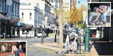  ?? PHOTOS: CHRISTINE O’CONNOR ?? Feed the birds . . . Pigeons were not going to miss out on the kindness bestowed by an 83yearold man concerned for their welfare in Dunedin yesterday under Alert Level 3. Below: Rebecca Quin, of Dunedin, takes advantage of a subdued CBD to grab a couple of coffees from Modaks as owner Jack Bradbury looks on.