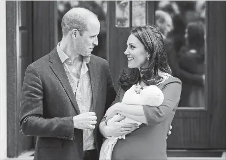  ?? KIRSTY WIGGLESWOR­TH THE ASSOCIATED PRESS ?? Britain’s Prince William and Kate, Duchess of Cambridge pose for a photo with their newborn baby son at St Mary’s Hospital in London, Monday.